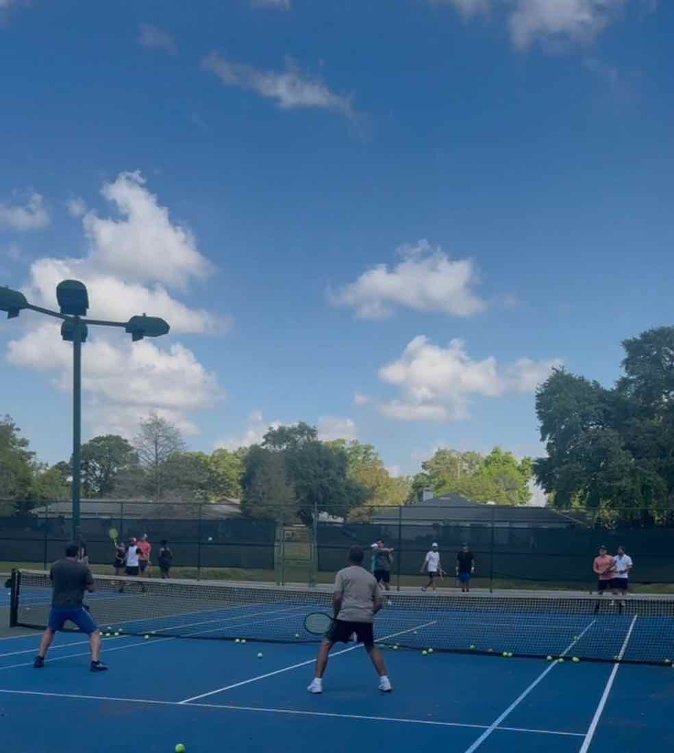 Doubles match play under blue skies